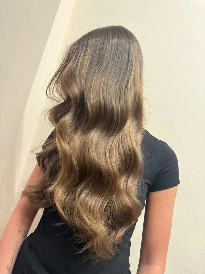 Long bronde balayage finished with soft glamour waves