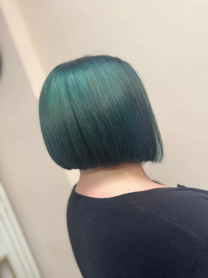Teal colour on a sleek, sharp bob